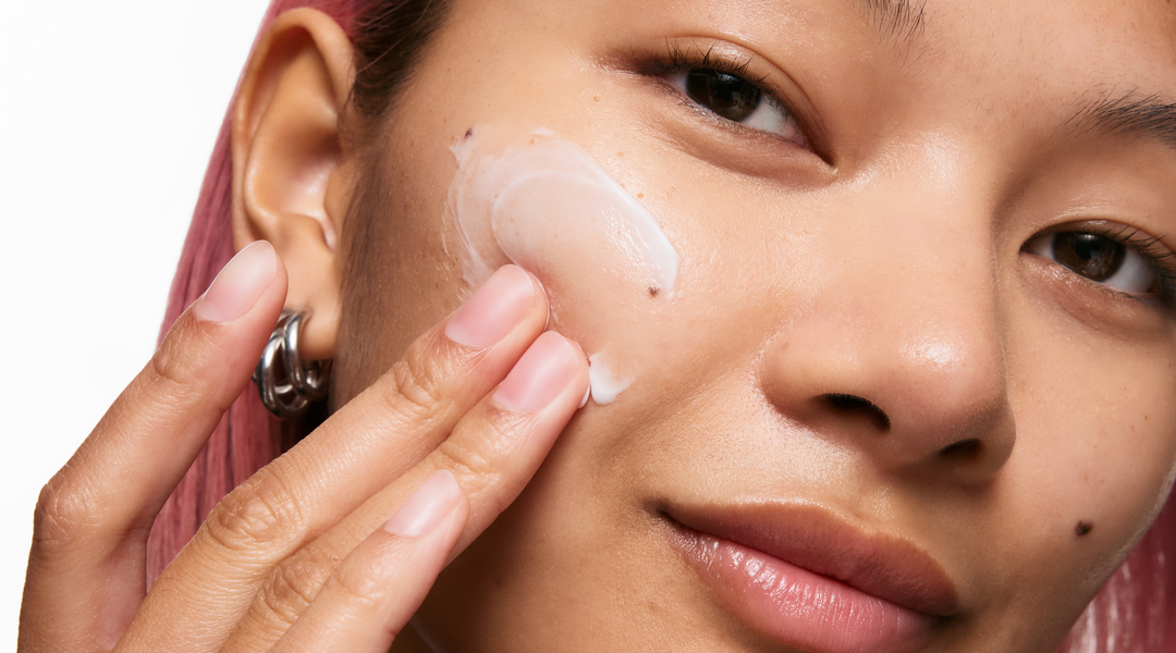 Model with skincare swatch on face