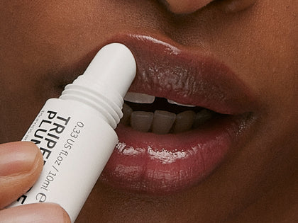 Model applying lip balm