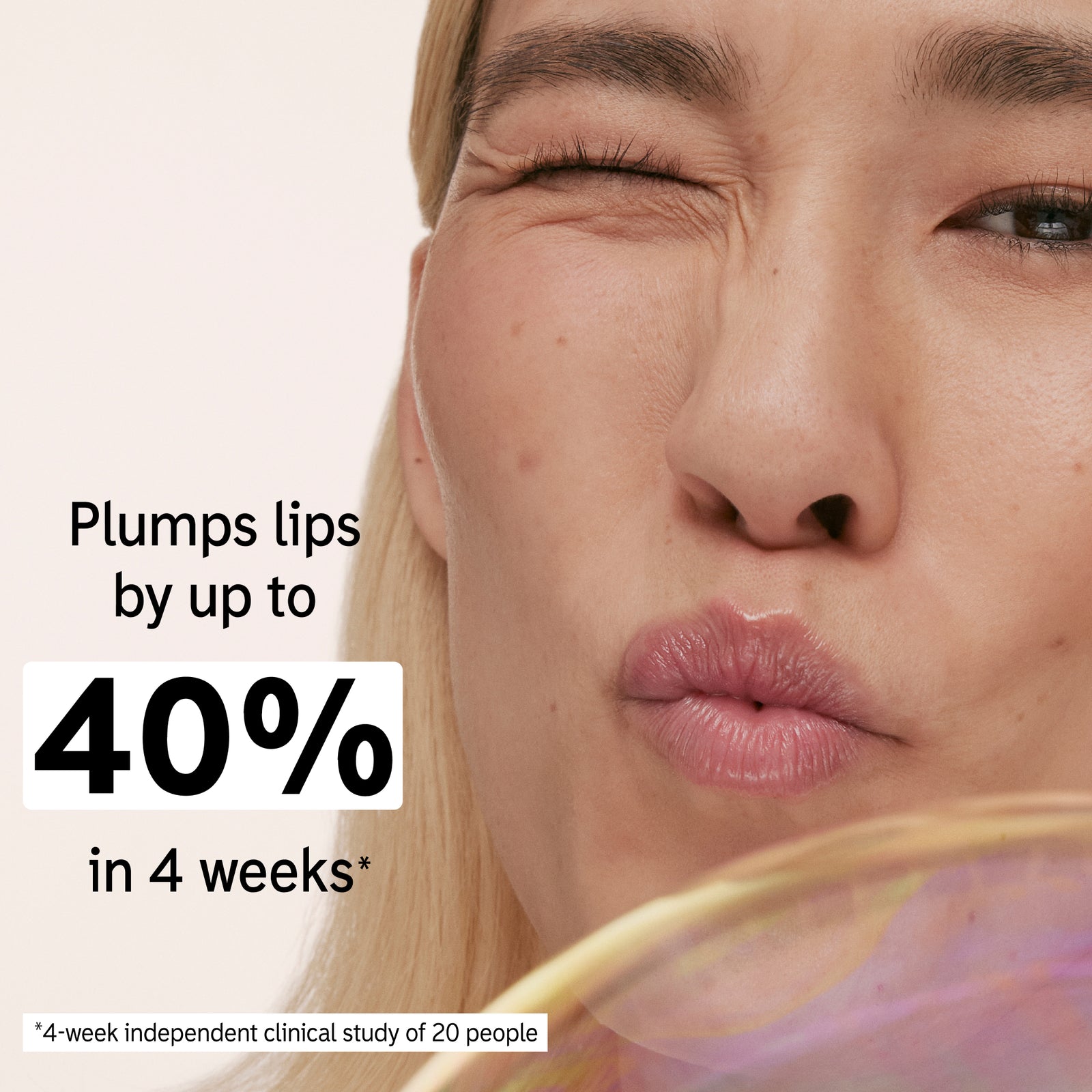 Model holding Tripeptide Lip Balm with key claim statistic