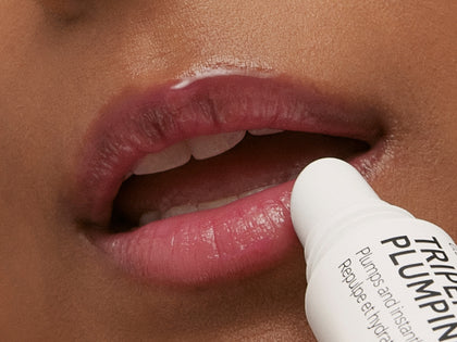 Model applying Lip Balm