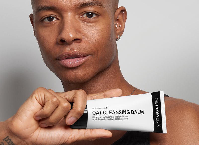 Male model holding Oat Cleansing Balm
