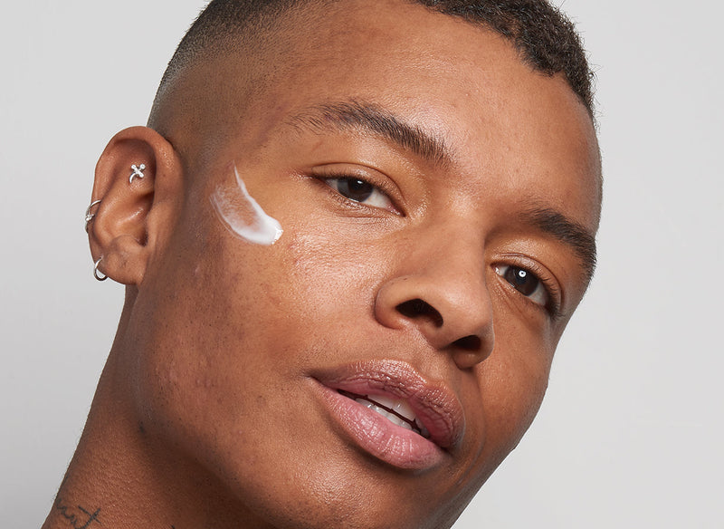 Male model with serum on his cheek