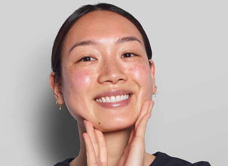 Model holding her face