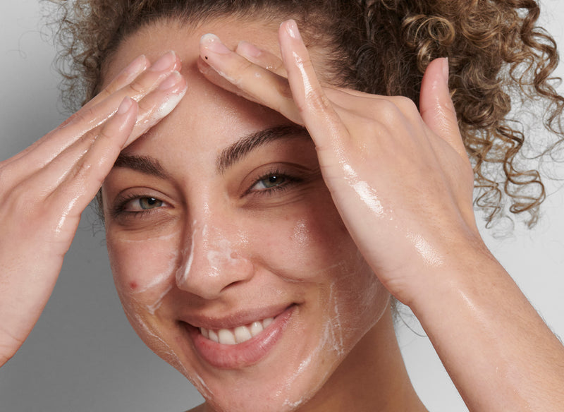 Model washing her face