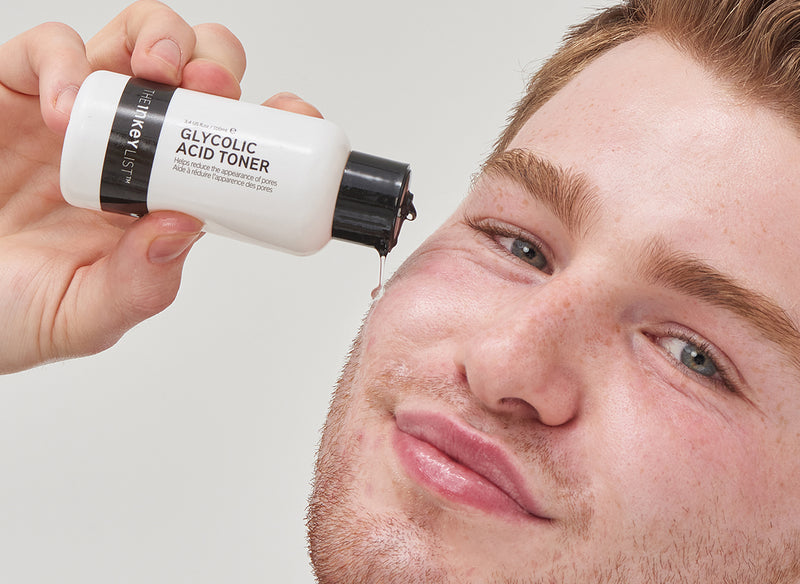 Male model applying Glycolic Acid Serum