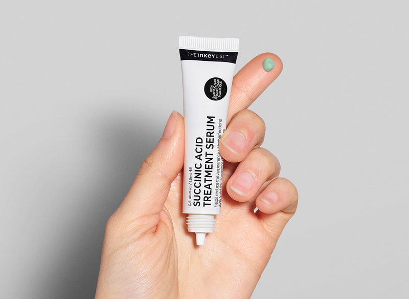 Succinic Acid on fingertip