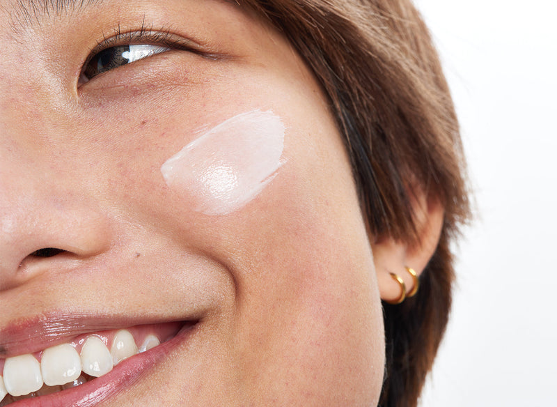 Model with serum on her cheek