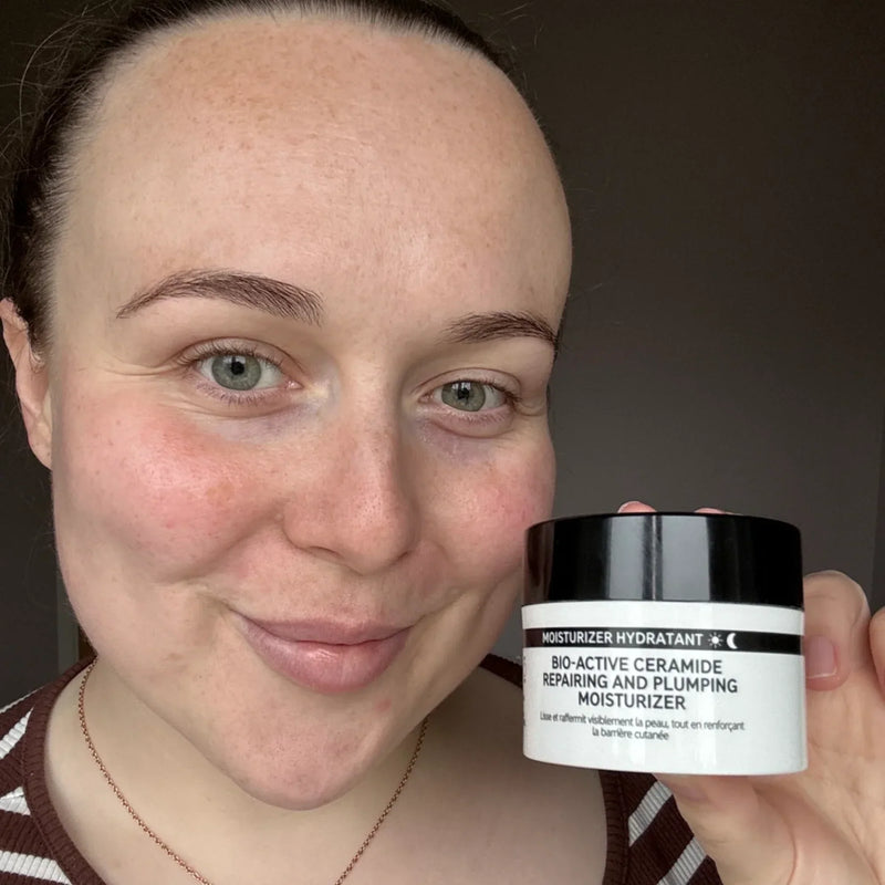woman holding bio active. moisturiser