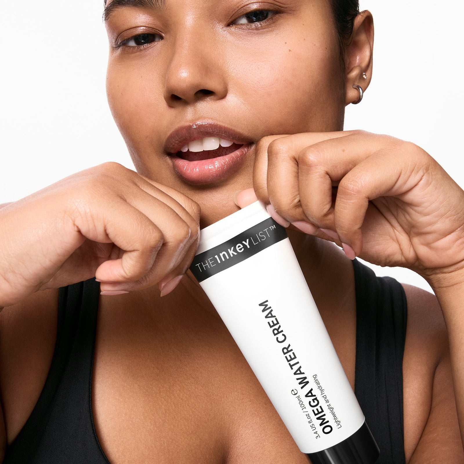 Model holding Omega Water Cream