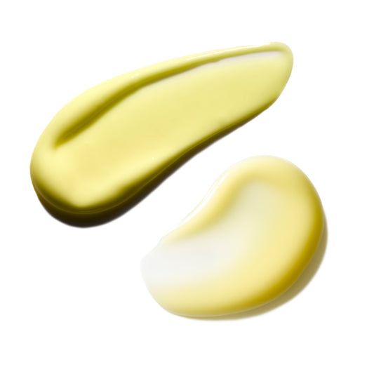Two yellow cream swatches on a white background