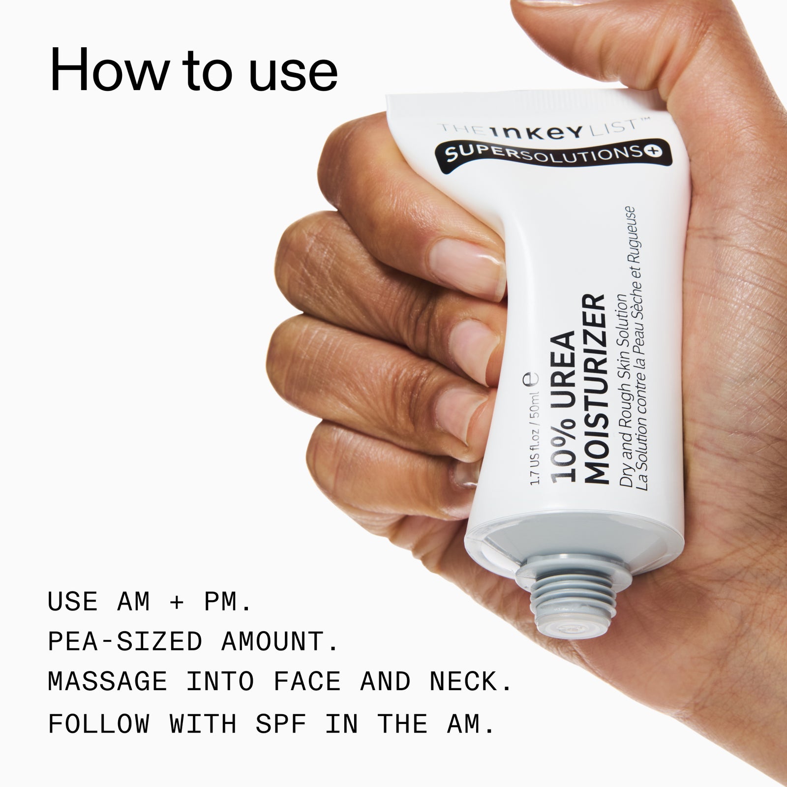 Hand holding a tube of Inkey List SuperSolutions 10% Urea Moisturizer with usage instructions.