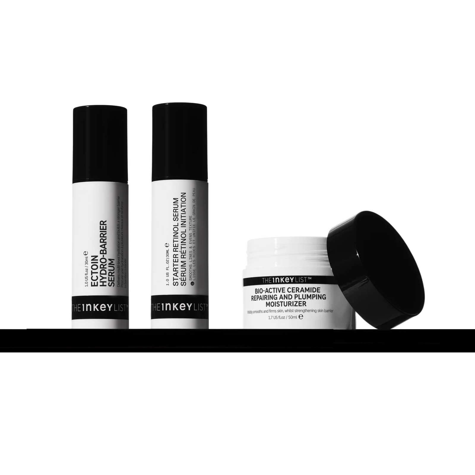 Inkey List skincare products including serum bottles and a cream jar on a white background