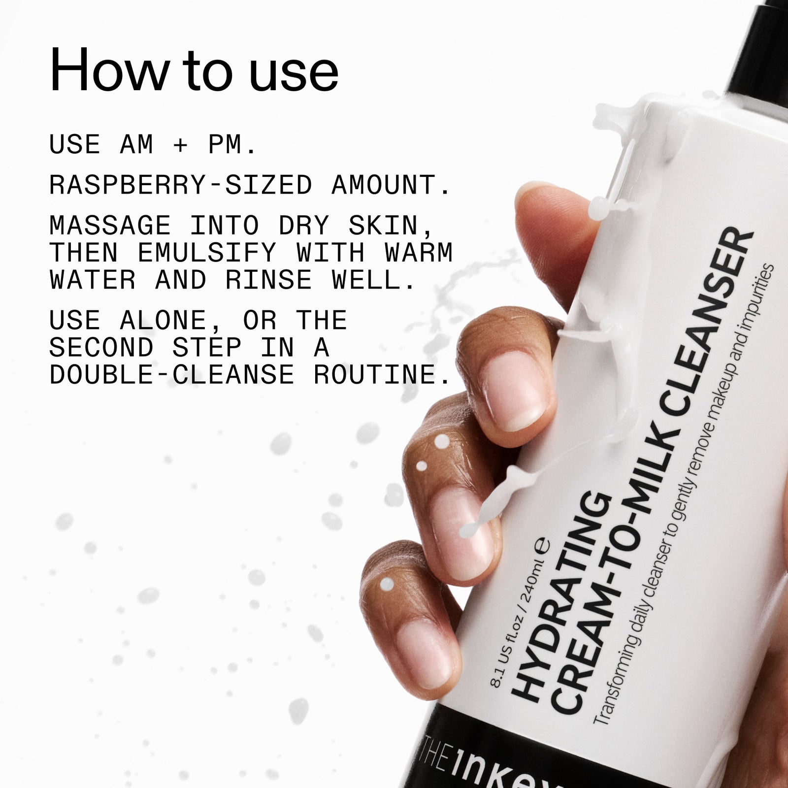 Hand holding aMilk Cleanser with usage instructions on a white background