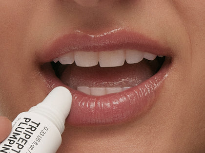 Model applying lip balm