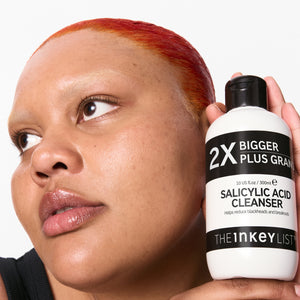 Model holding Supersize Salicylic Acid Cleanser