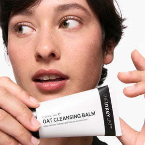 Model holding Oat Cleansing Balm