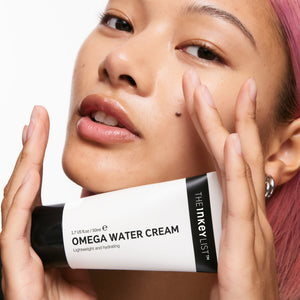 Model with omega water cream