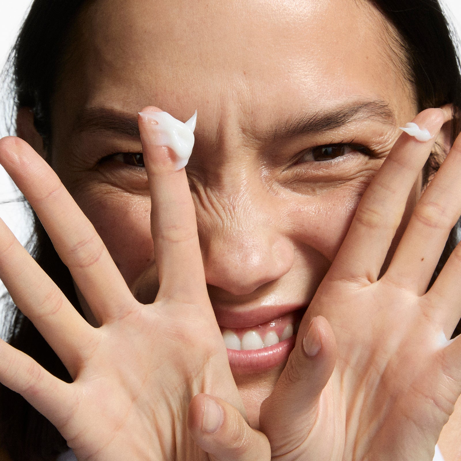Model with product on her fingers