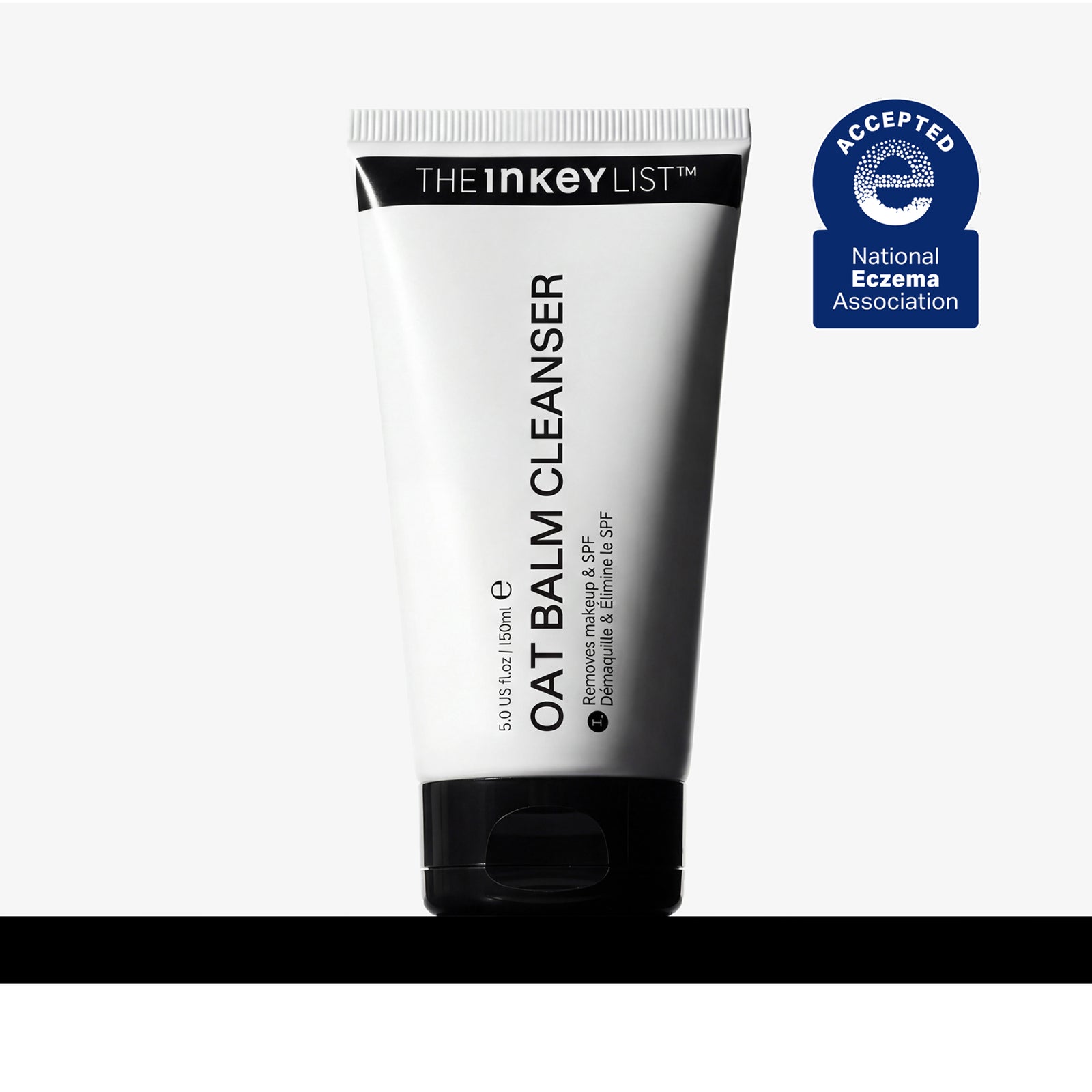 A 50ml squeeze tube of The Inkey List Oat Balm Cleanser, shown on a light gray background with a black horizontal bar at the bottom and a blue National Eczema Association Accepted badge on the top right.