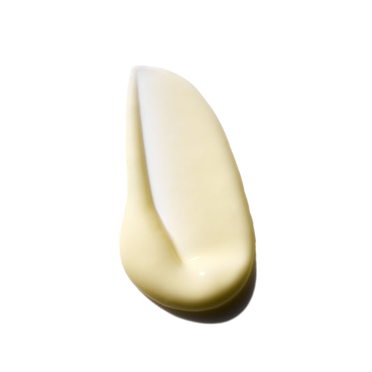 Close-up of a beige cream swatch on a white background