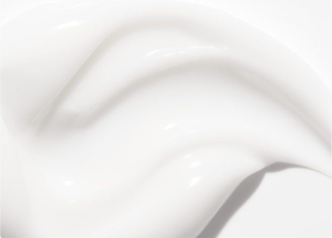 Close-up of face cream smeared on a white background